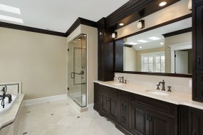 Master bath with dark cabinetry
