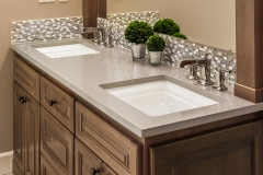 Bathroom Detail in New Luxury Home: Double Vanity with Two Sinks, Faucets, Cabinets, and Mirror