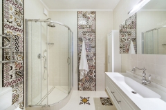 interior of a bathroom with shower and washbasin