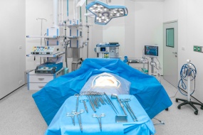 Interior view of operating room with equipment and medical devices in modern operating room at hospital.